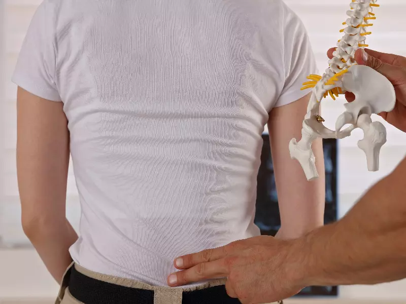 SI Joint Pain Treatment Near Me in Jackson Township, NJ. Chiropractic Exam For SI Joint Pain Relief.